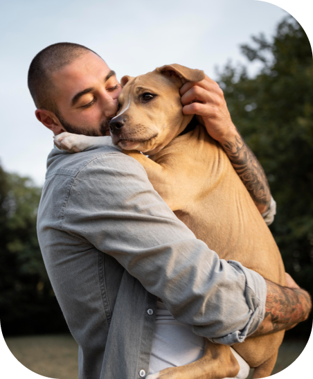 Person hugging a dog